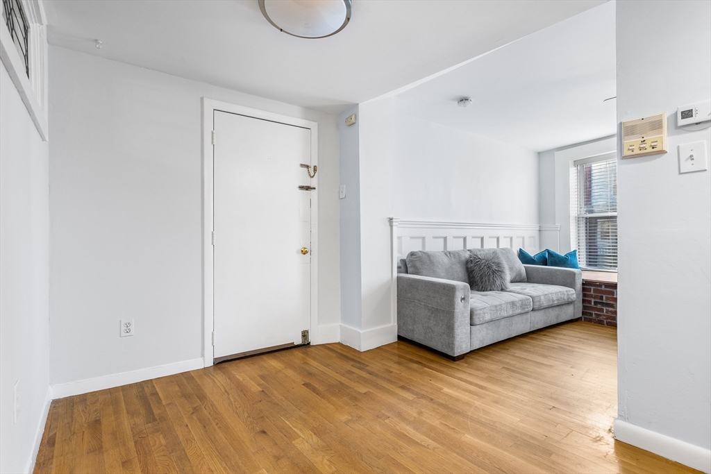 86 Savin Hill Avenue, Unit 1 Boston, MA 02125 - Photo 6 of 17 a view of a livingroom with furniture and a couch