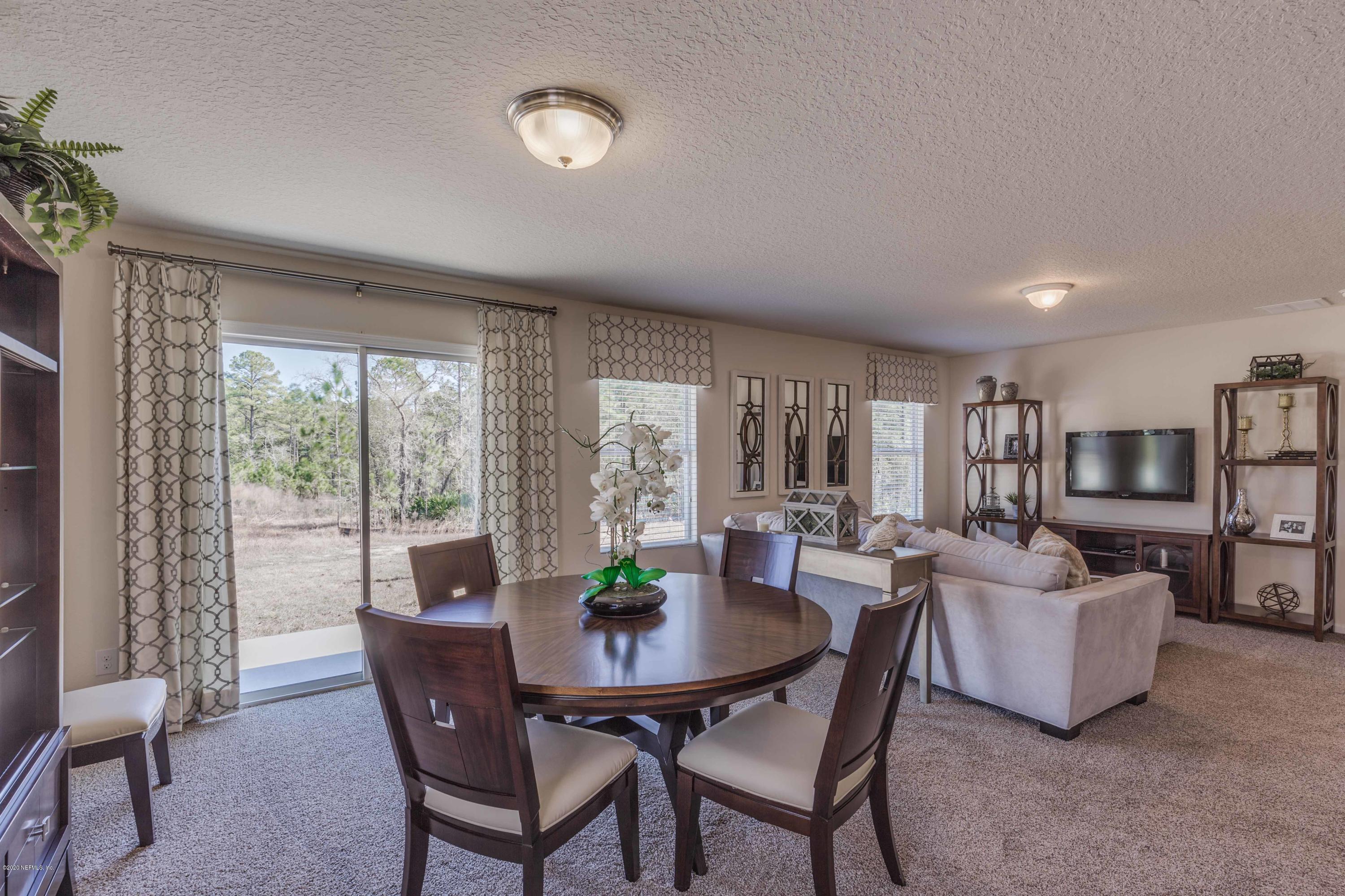 3820 Great Falls Loop Middleburg, FL 32068 - Photo 11 of 36 a view of a dining room with furniture window and outside view