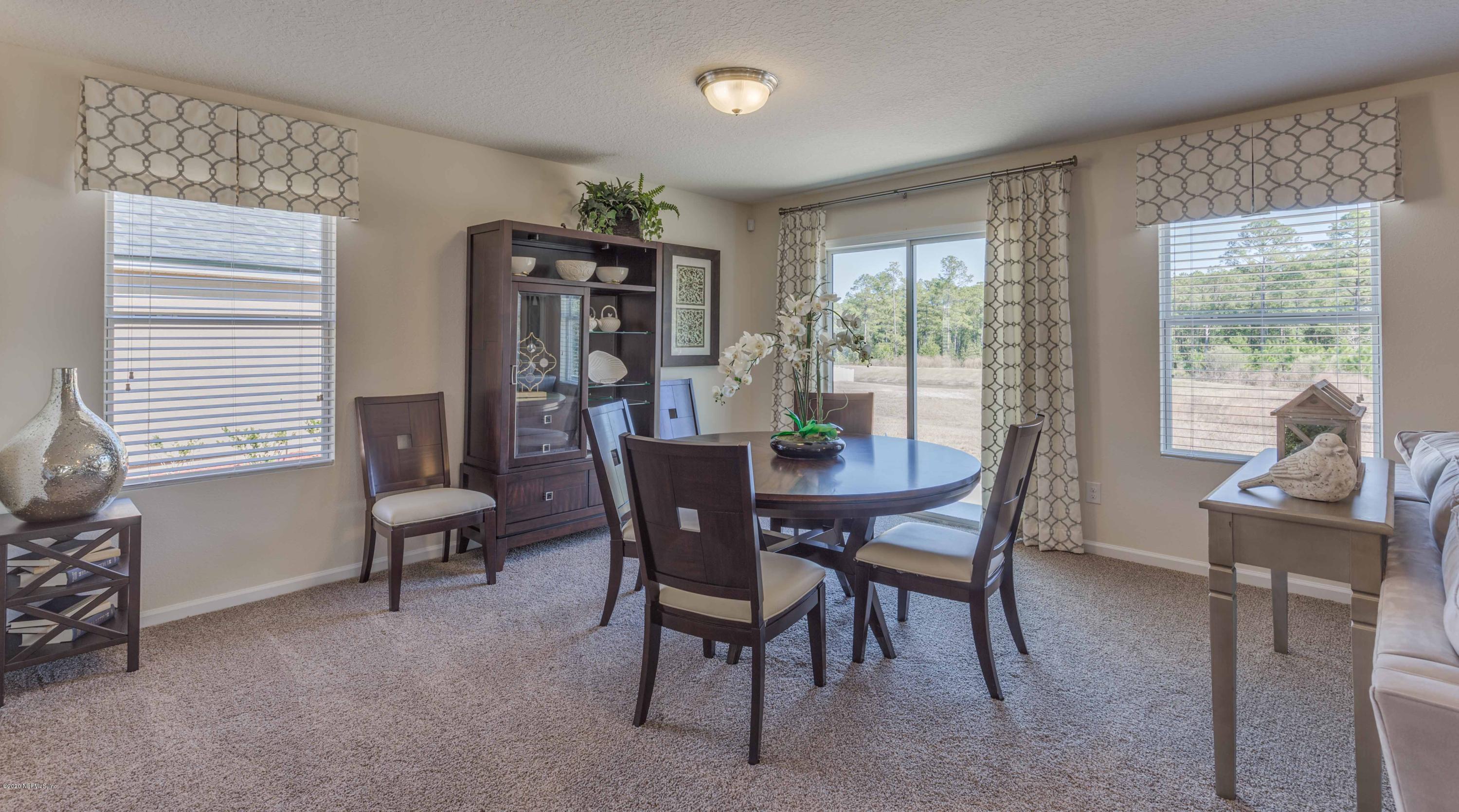 3820 Great Falls Loop Middleburg, FL 32068 - Photo 13 of 36 a view of a dining room with furniture window and outside view