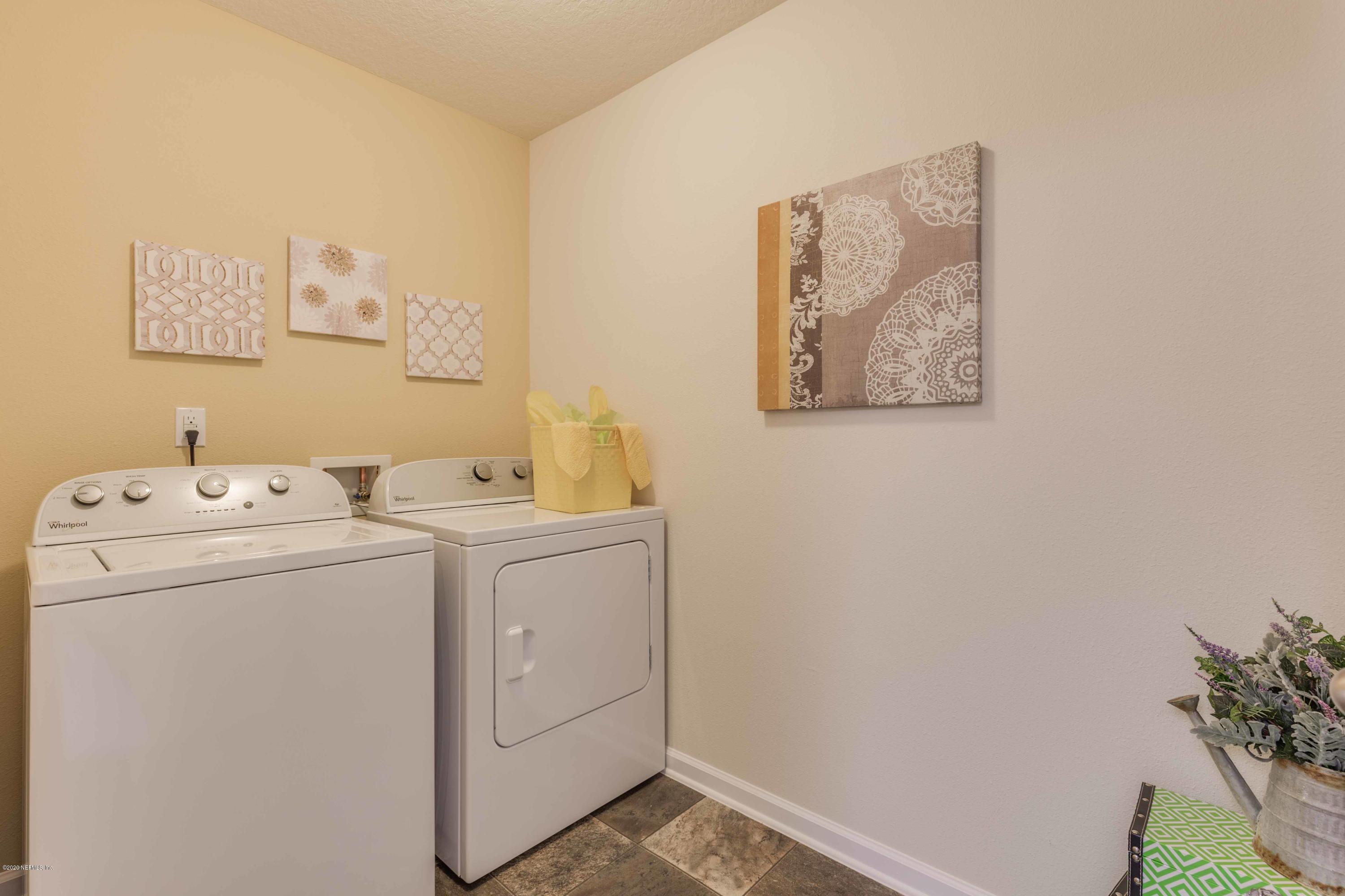 3820 Great Falls Loop Middleburg, FL 32068 - Photo 23 of 36 a utility room with dryer and washer