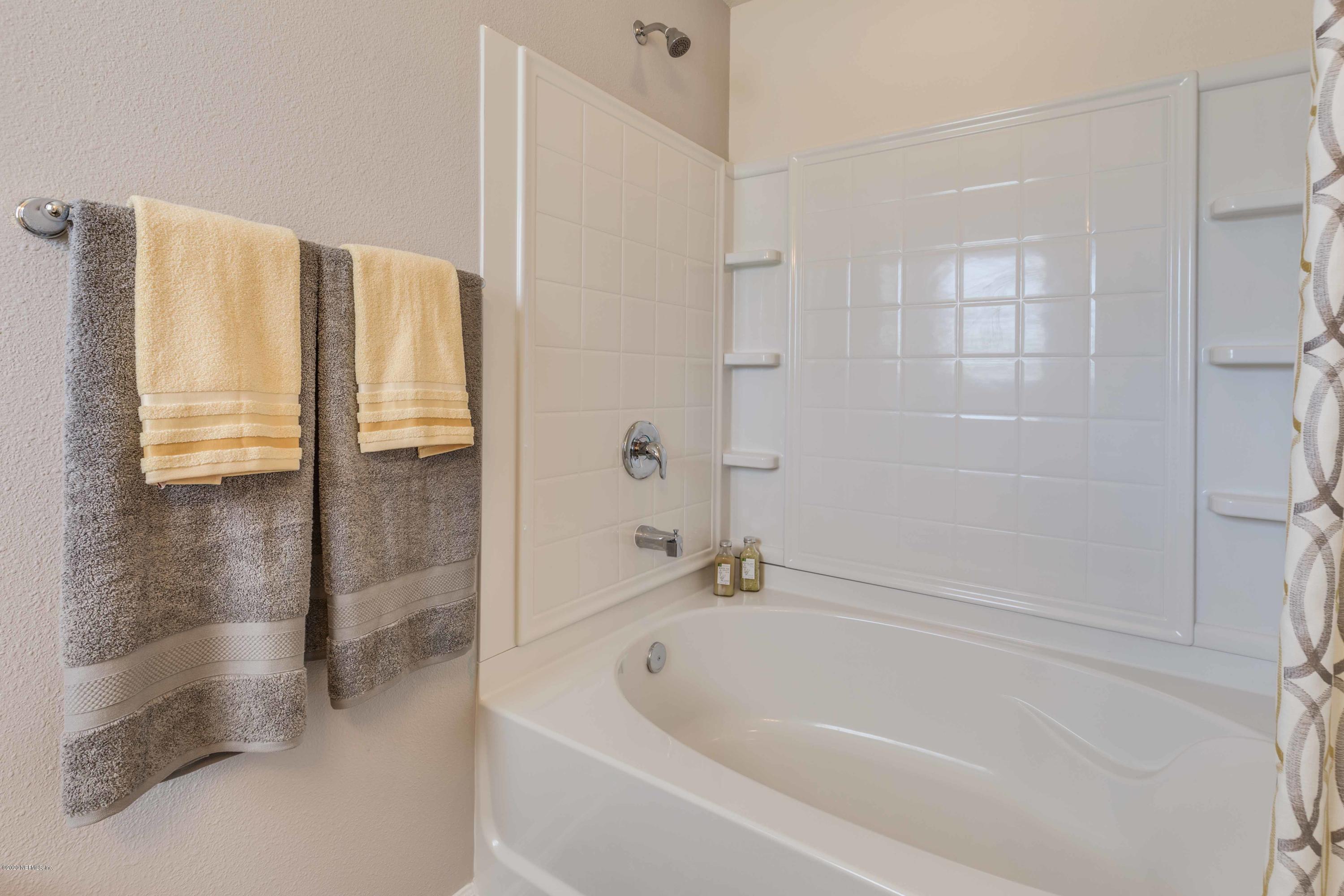 3820 Great Falls Loop Middleburg, FL 32068 - Photo 25 of 36 a white bath tub sitting next to a shower