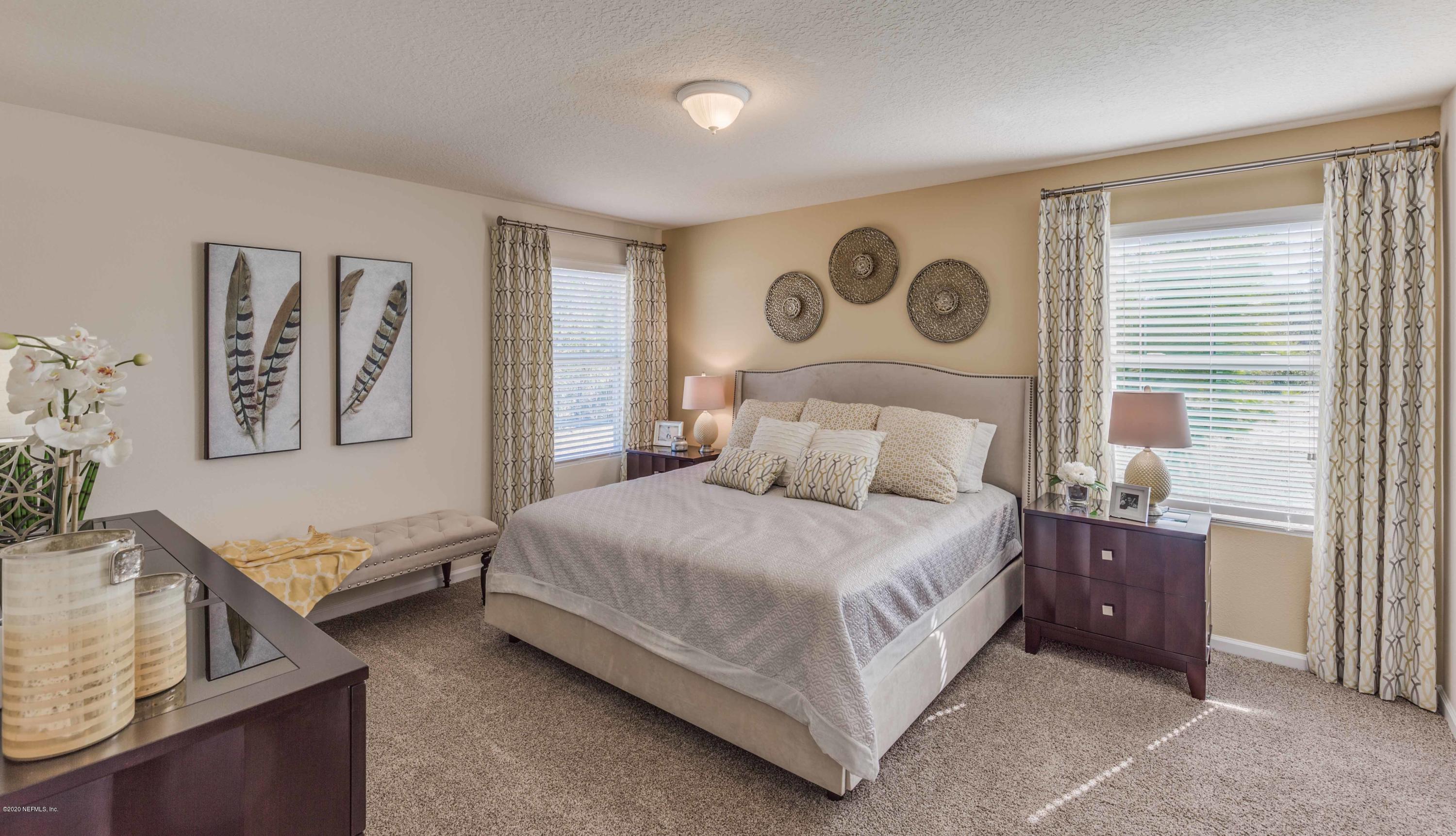 3820 Great Falls Loop Middleburg, FL 32068 - Photo 26 of 36 a bedroom with a bed and a window