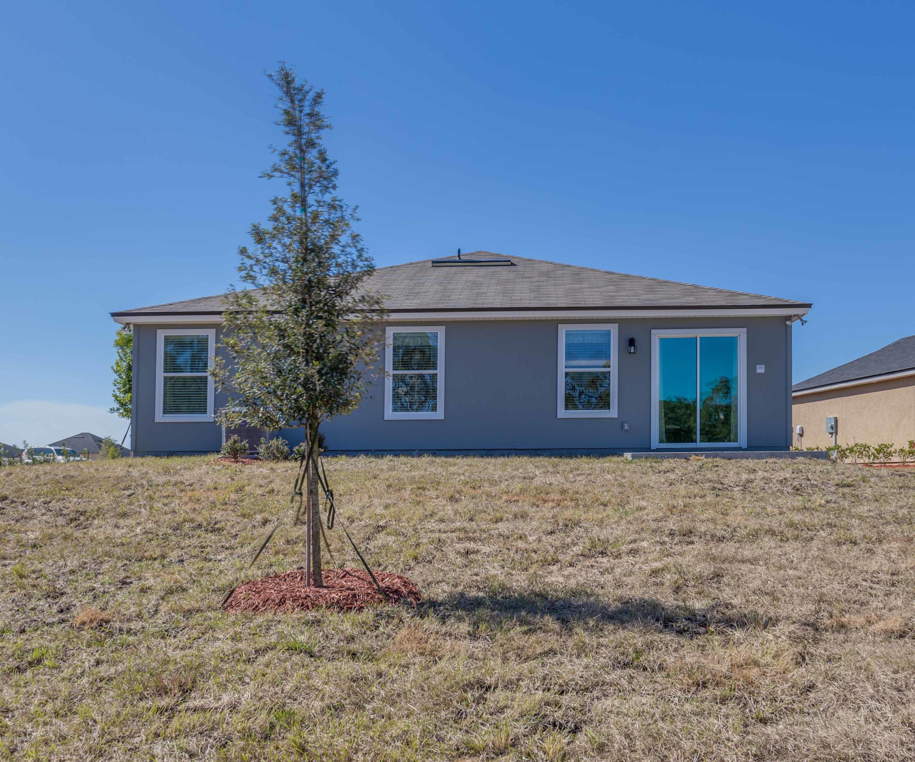 3820 Great Falls Loop Middleburg, FL 32068 - Photo 29 of 36 a house with trees in front of it