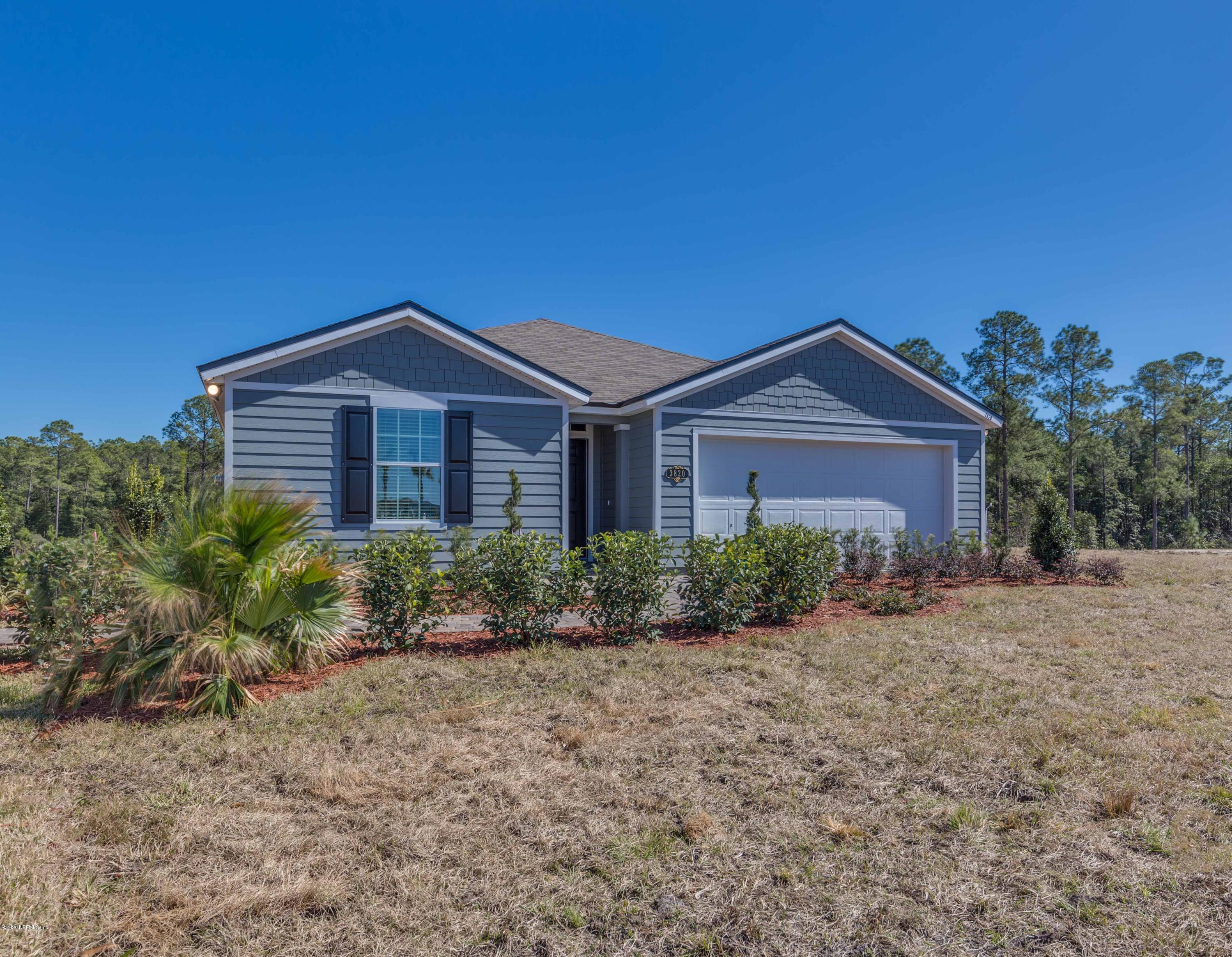 3820 Great Falls Loop Middleburg, FL 32068 - Photo 3 of 36 a front view of a house with a yard