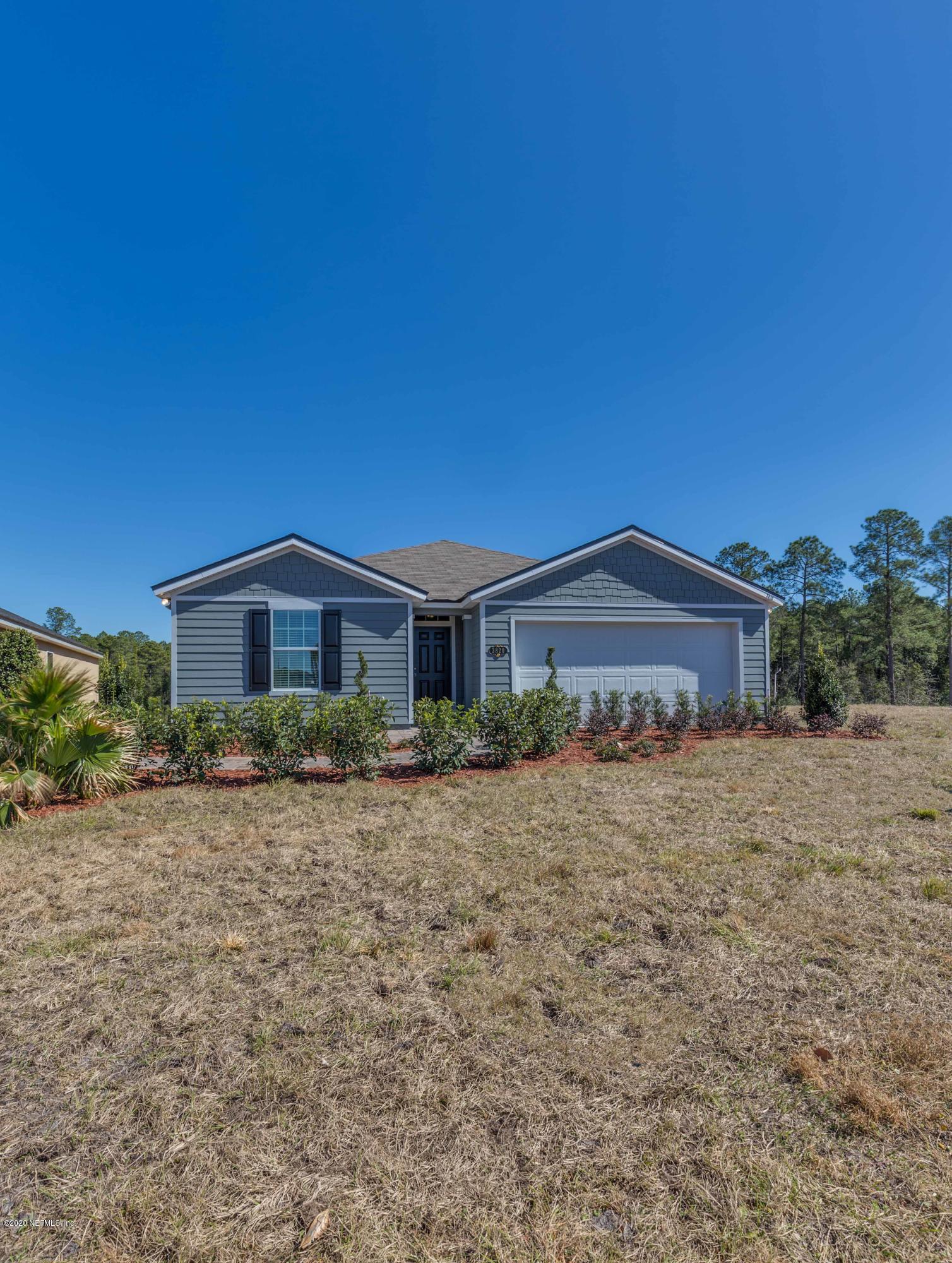 3820 Great Falls Loop Middleburg, FL 32068 - Photo 4 of 36 a front view of a house with a yard
