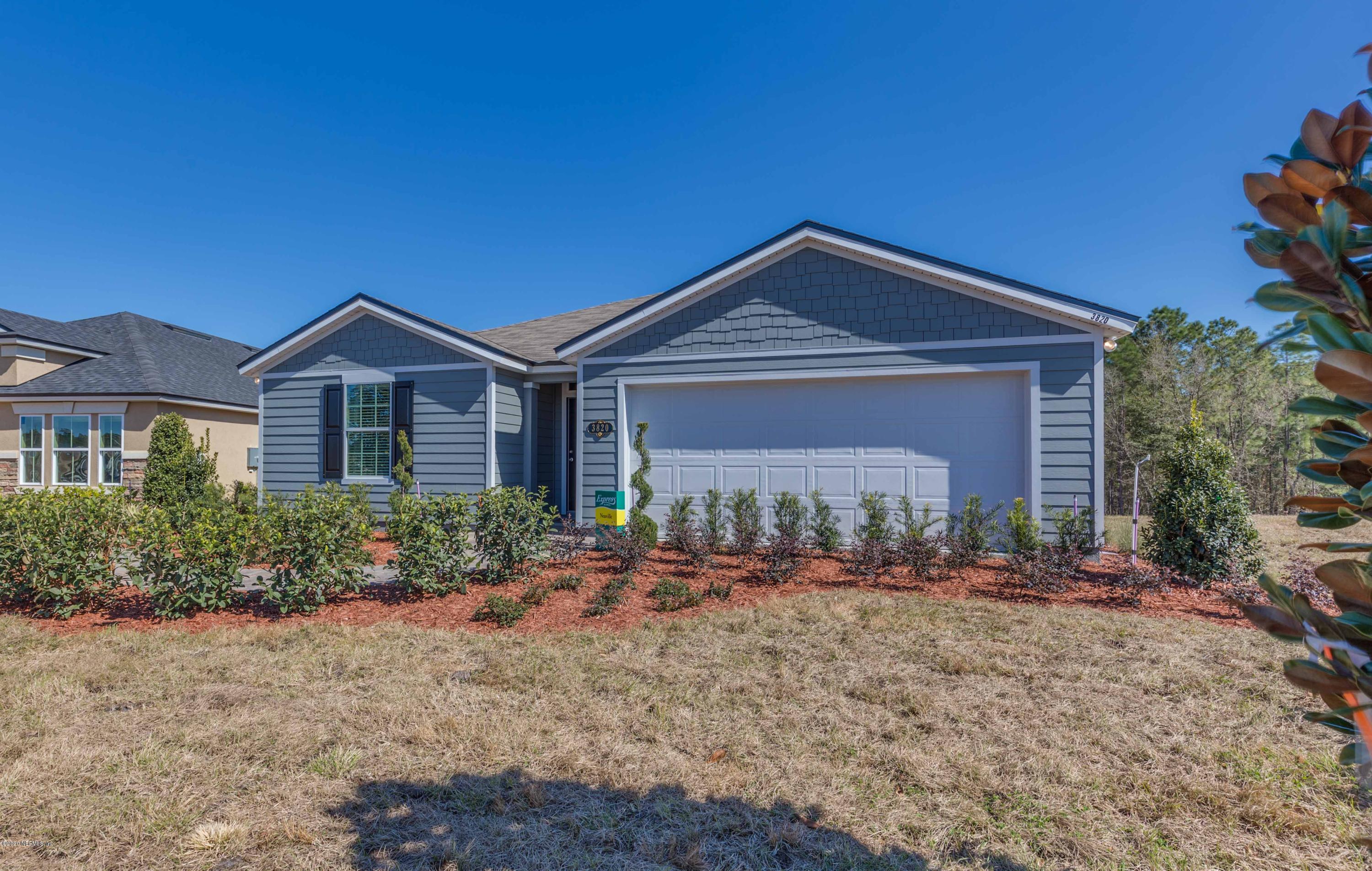 3820 Great Falls Loop Middleburg, FL 32068 - Photo 5 of 36 a front view of a house with garden