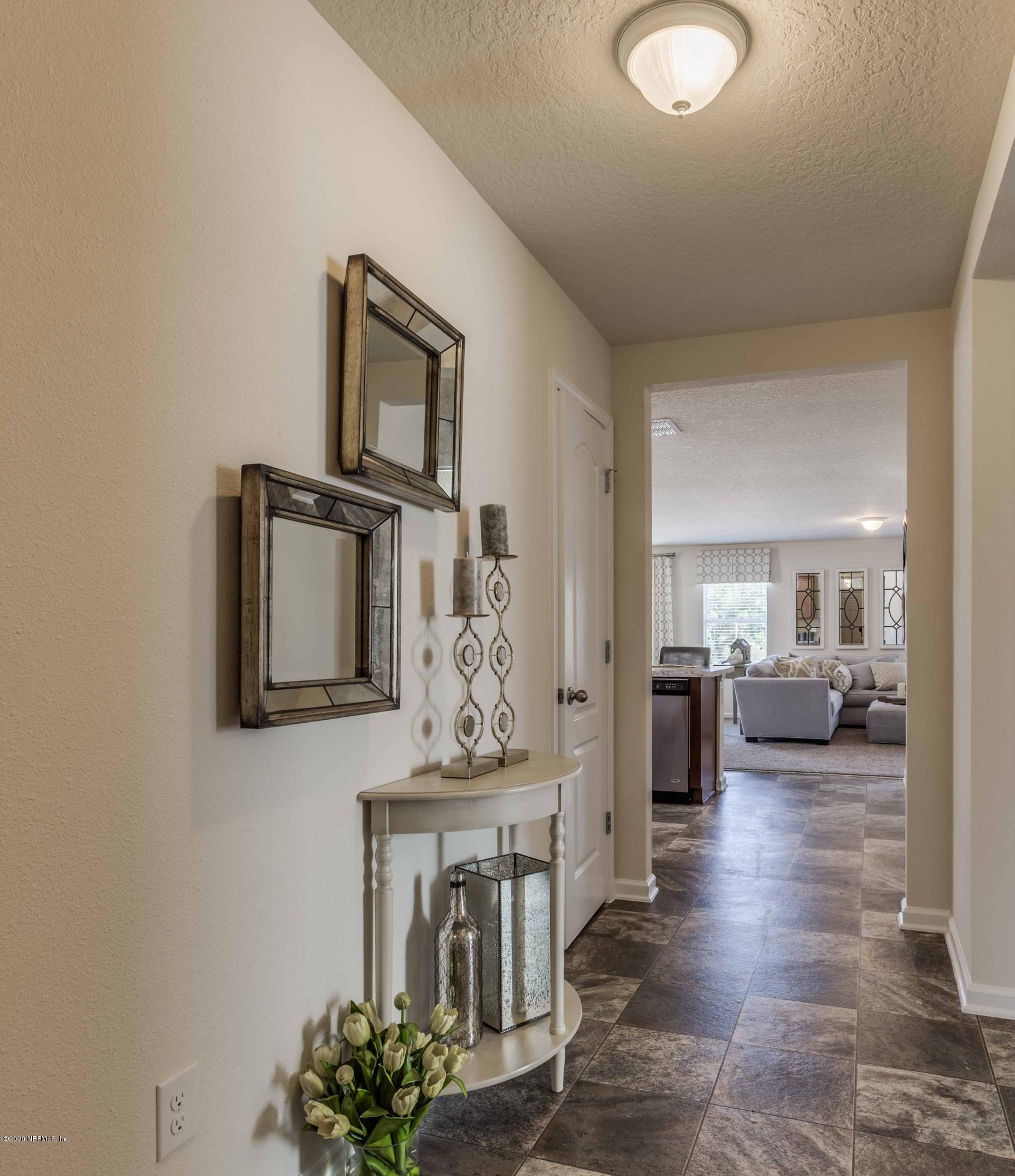 3820 Great Falls Loop Middleburg, FL 32068 - Photo 6 of 36 a view of a livingroom with furniture and a flat screen tv