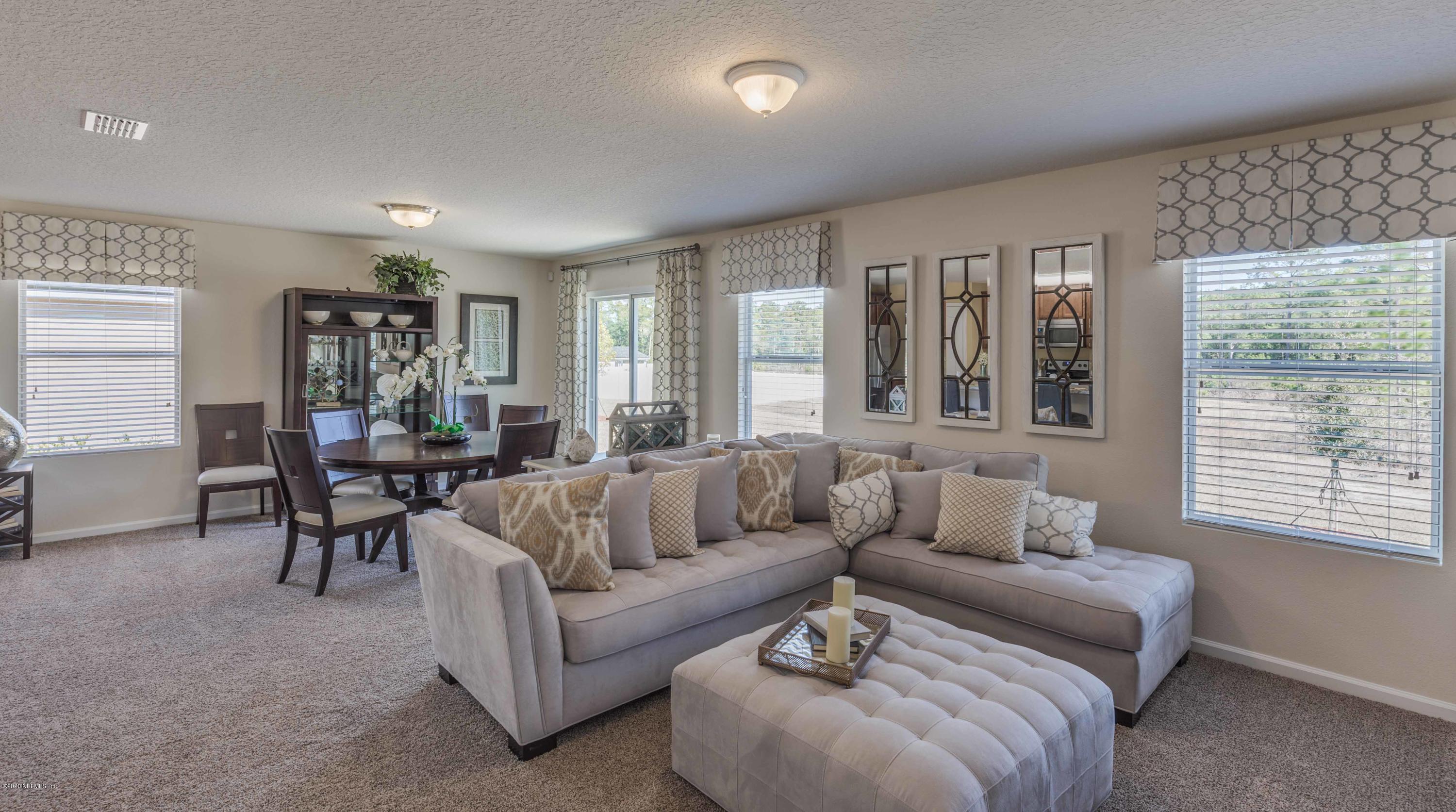 3820 Great Falls Loop Middleburg, FL 32068 - Photo 9 of 36 a living room with furniture and windows