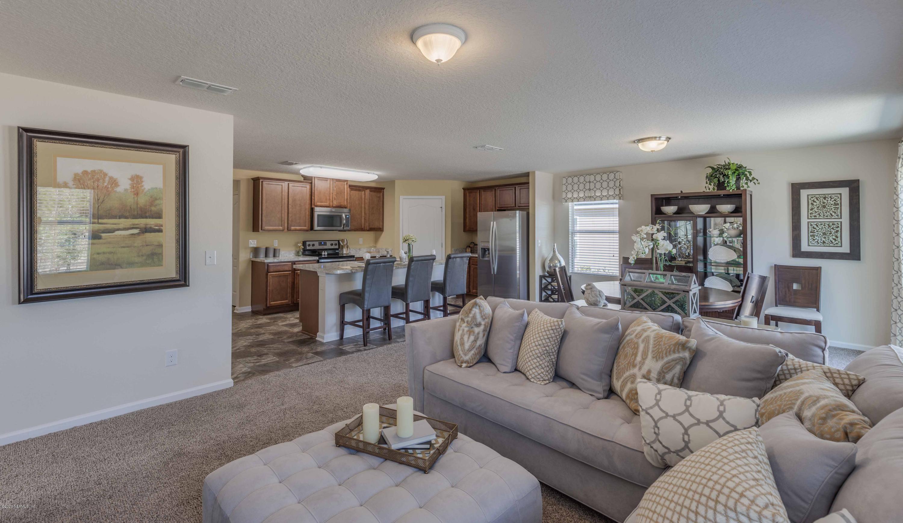 3820 Great Falls Loop Middleburg, FL 32068 - Photo 10 of 36 a living room with furniture and wooden floor