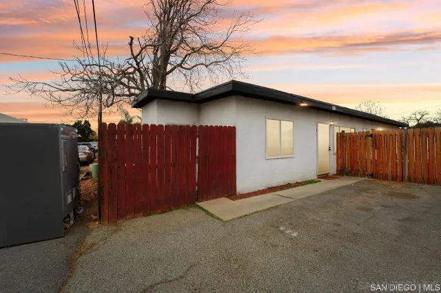 a house with trees in the background