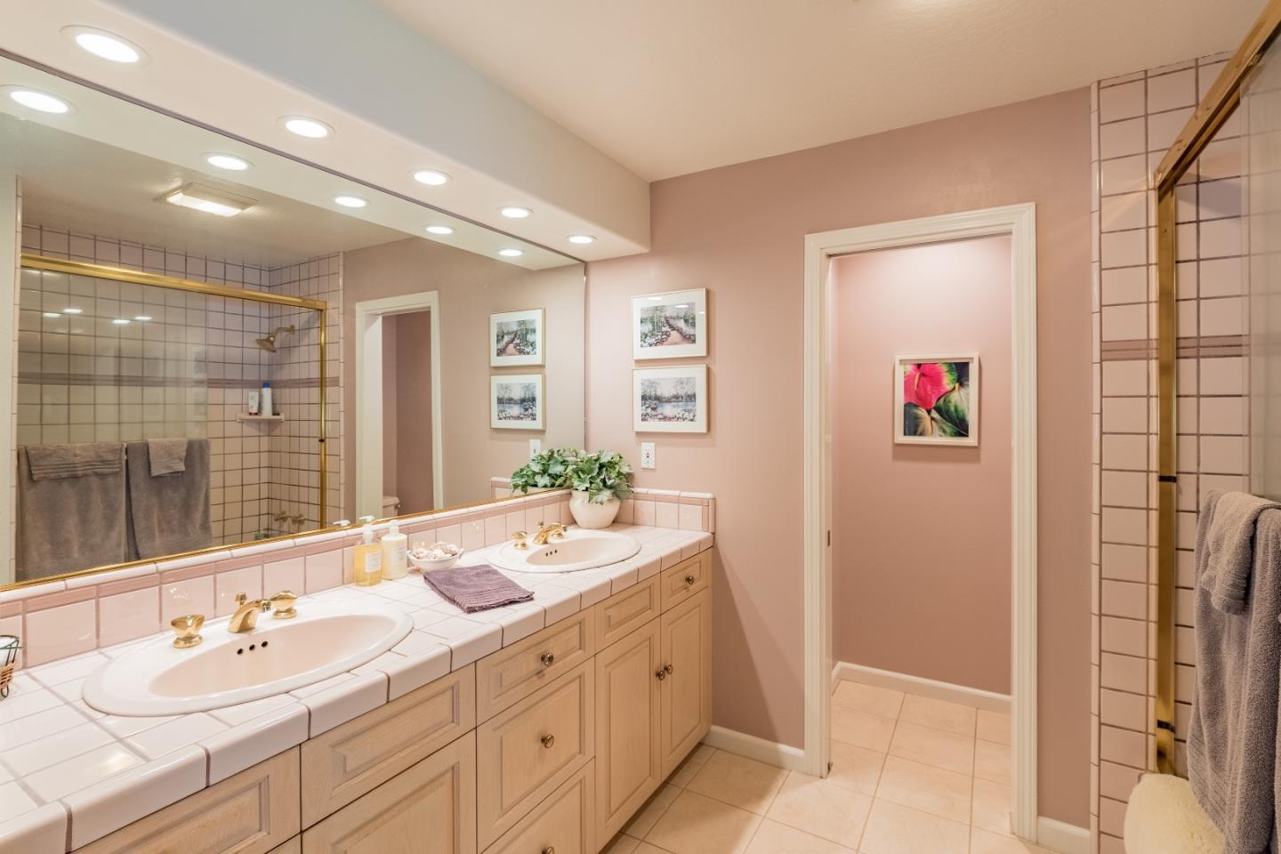 150 Nelson Road Scotts Valley, CA 95066 - Photo 7 of 11 a spacious bathroom with a double vanity sink mirror and shower