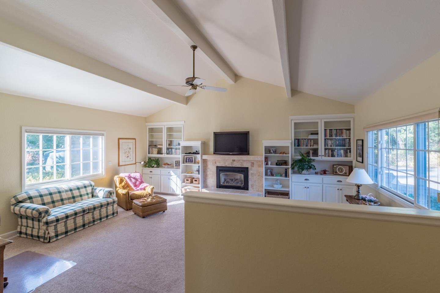 150 Nelson Road Scotts Valley, CA 95066 - Photo 10 of 11 a living room with fireplace furniture and a flat screen tv