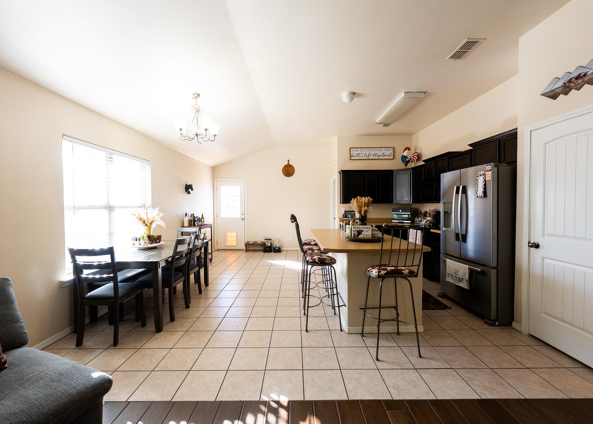 9104 Quincy Avenue Lubbock, TX 79424 - Photo 3 of 15 a view of a dining room with furniture