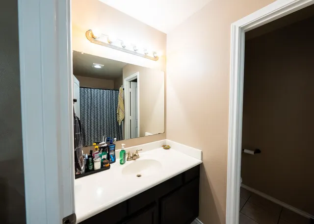 a view of hallway with wooden floor