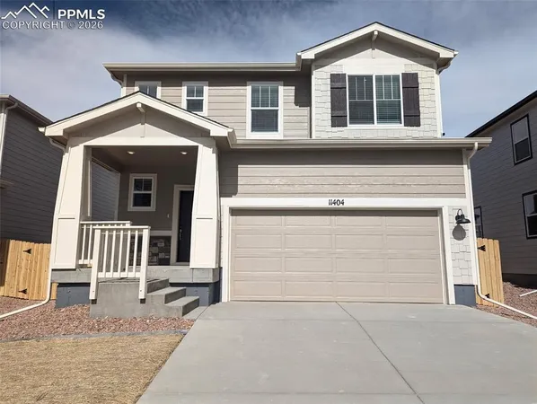 a front view of a house with a garage