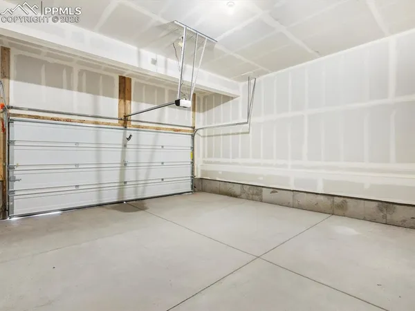 a view of an empty room with white walls