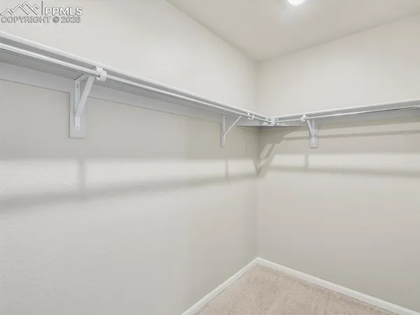 a view of an empty walk in closet