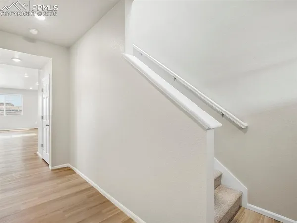 a view of entryway with wooden floor