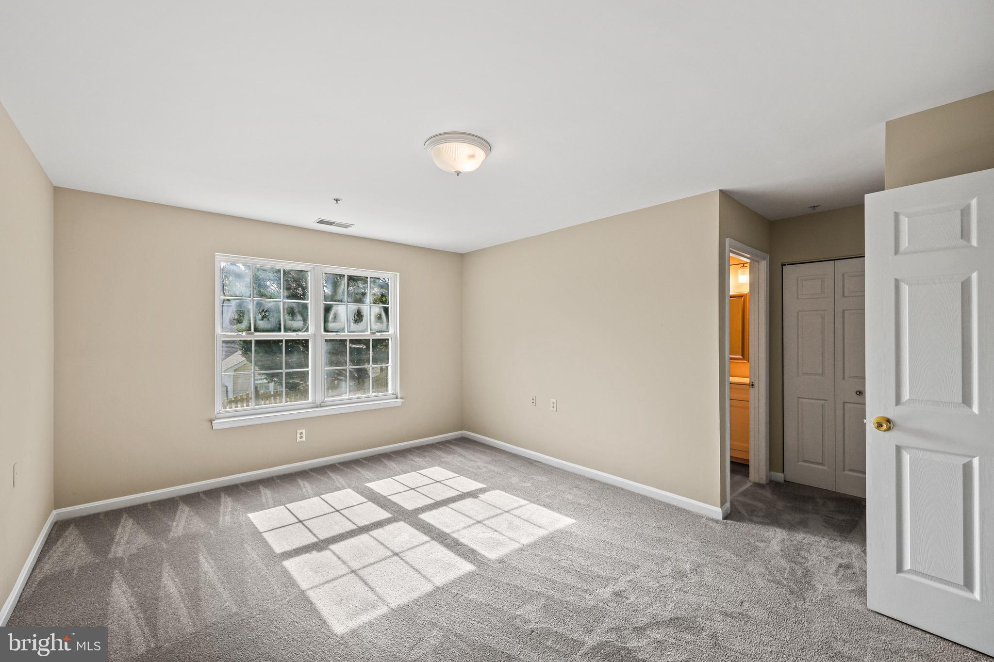 7409 Sandy Spring Road Laurel, MD 20707 - Photo 14 of 52 Primary bedroom looking into en suite bath