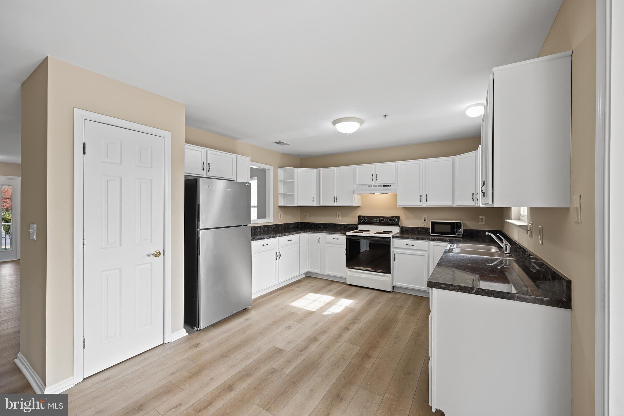 7409 Sandy Spring Road Laurel, MD 20707 - Photo 2 of 52 White kitchen cabinetry