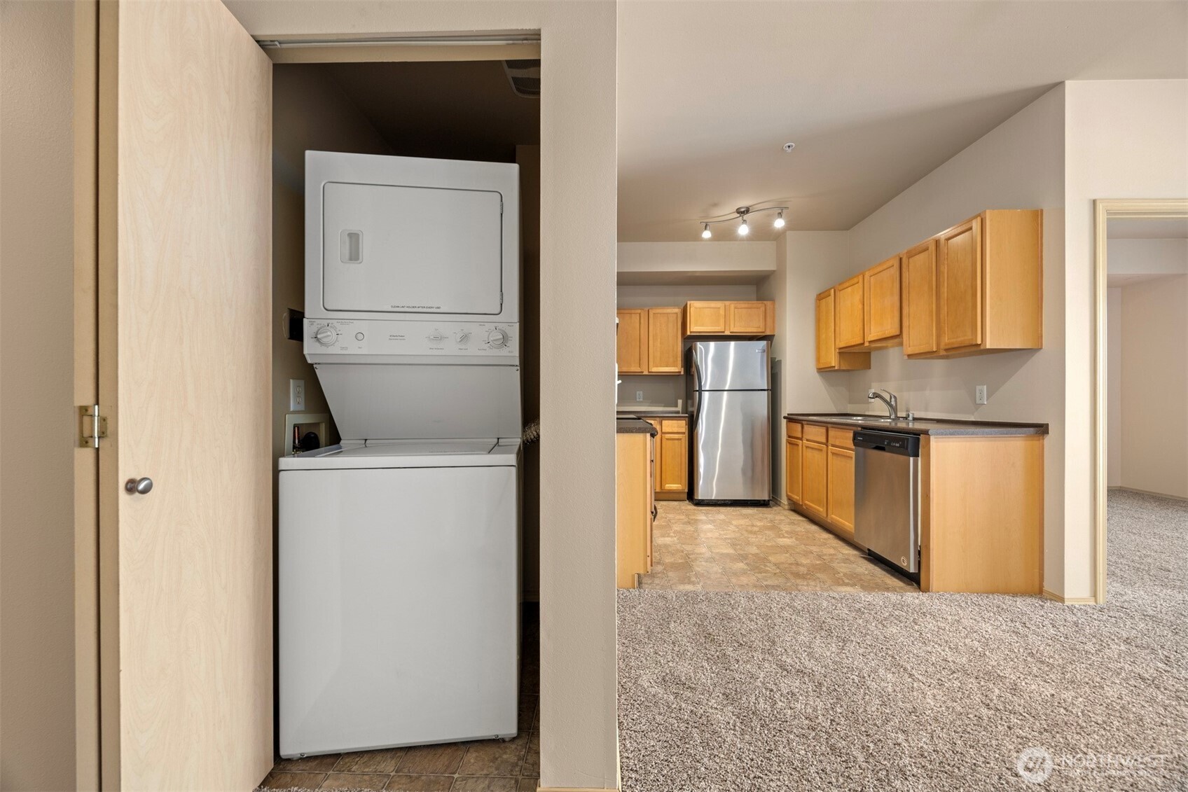 1031 North State Street, Unit 107 Bellingham, WA 98225 - Photo 13 of 33 a kitchen with a refrigerator and a stove