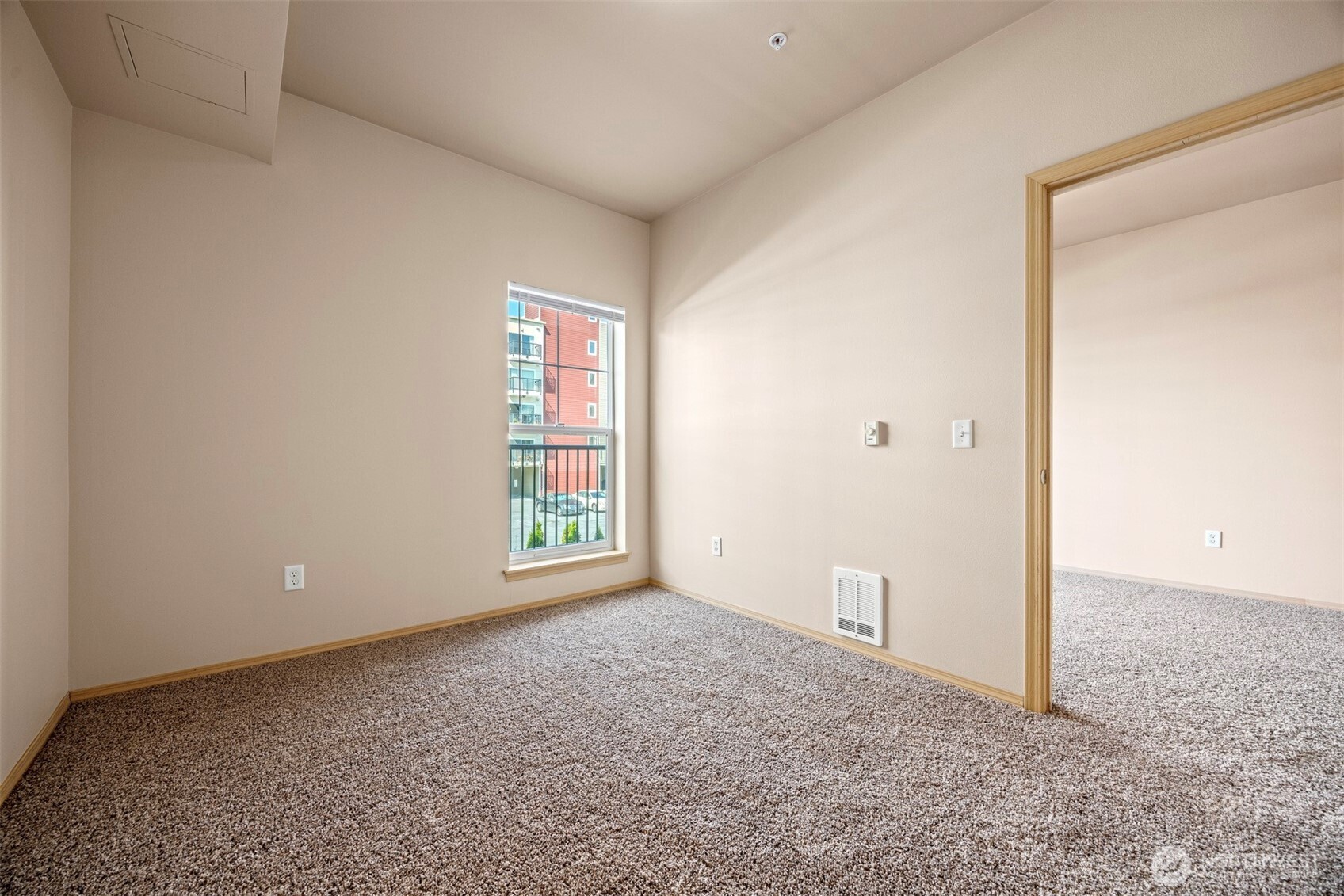1031 North State Street, Unit 107 Bellingham, WA 98225 - Photo 17 of 33 an empty room with windows