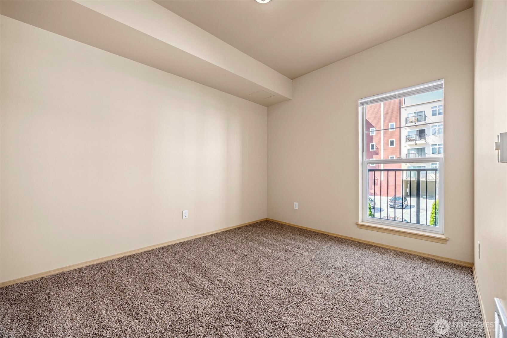 1031 North State Street, Unit 107 Bellingham, WA 98225 - Photo 18 of 33 an empty room with windows