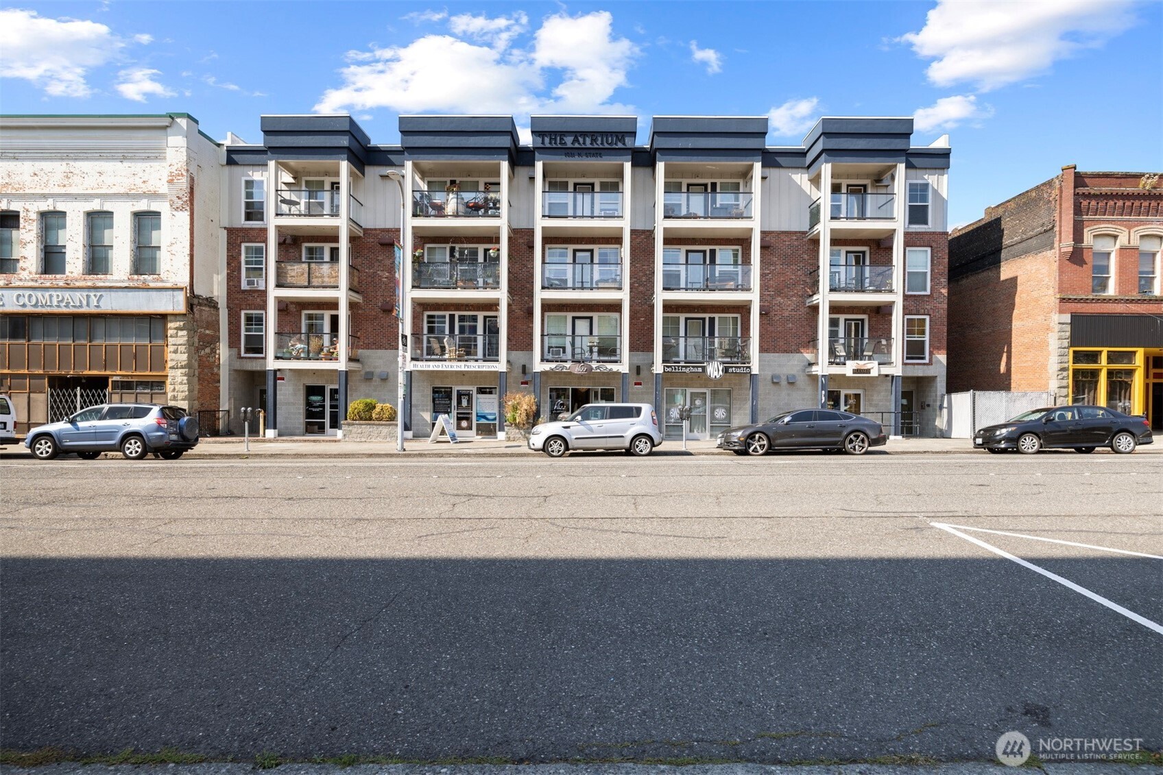 1031 North State Street, Unit 107 Bellingham, WA 98225 - Photo 2 of 33 a front view of a building with street