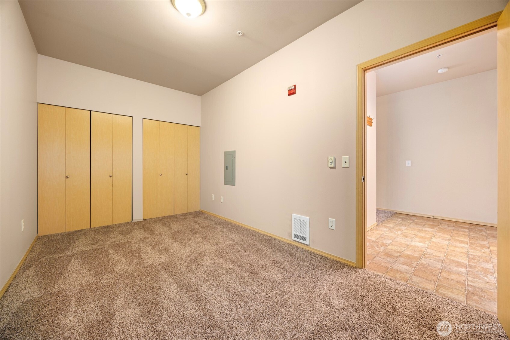 1031 North State Street, Unit 107 Bellingham, WA 98225 - Photo 21 of 33 an empty room with closet area