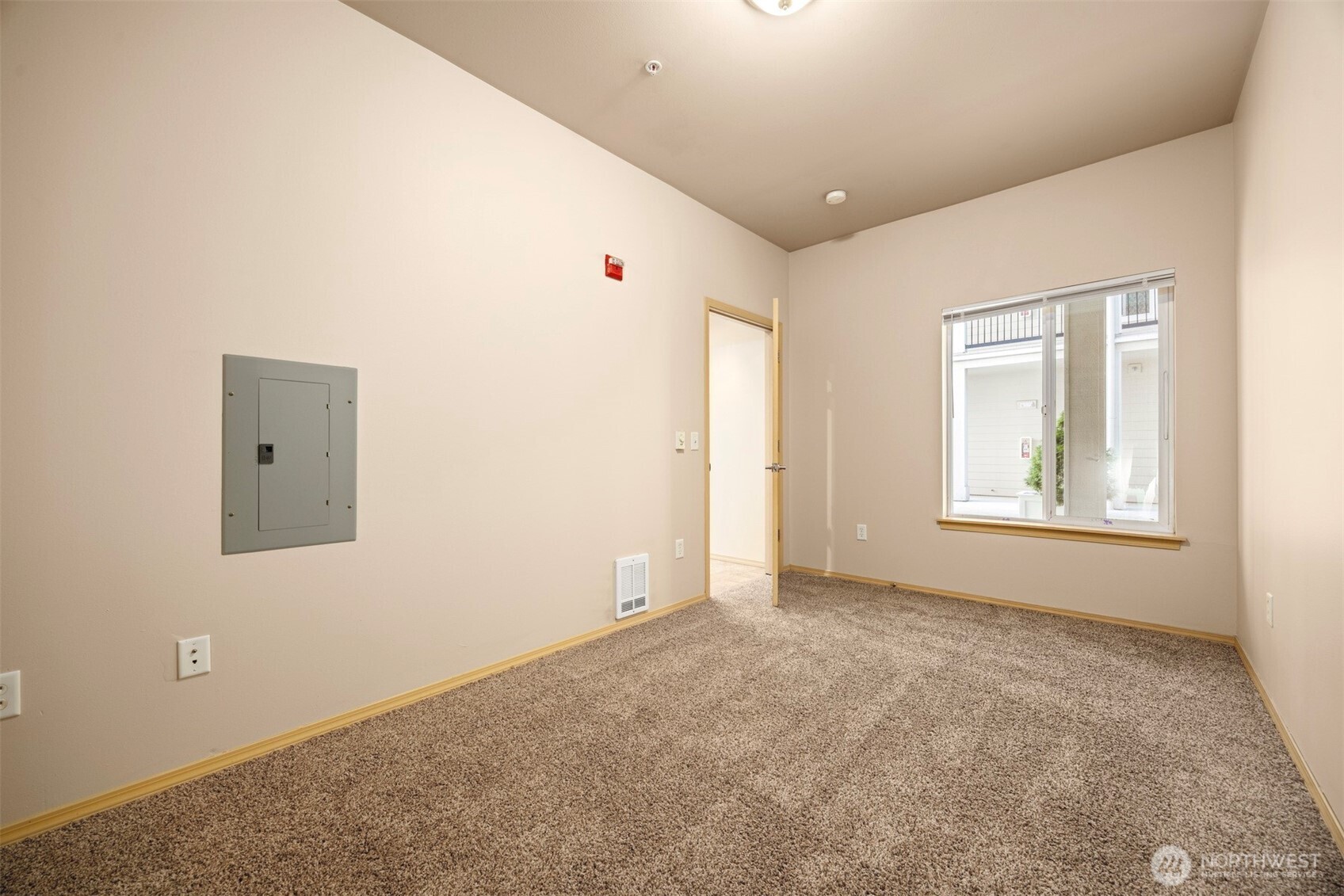 1031 North State Street, Unit 107 Bellingham, WA 98225 - Photo 23 of 33 an empty room with windows and closet