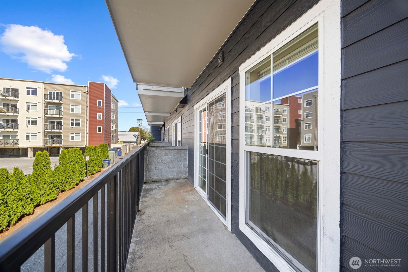 1031 North State Street, Unit 107 Bellingham, WA 98225 - Photo 26 of 33 a view of balcony with floor to ceiling windows and stairs