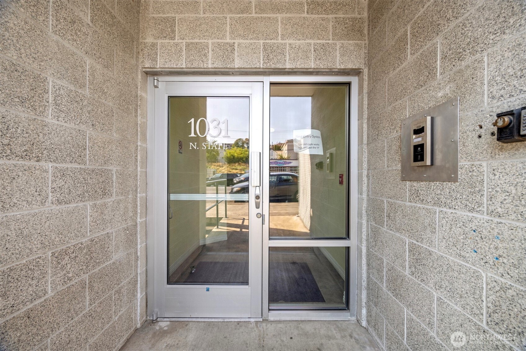1031 North State Street, Unit 107 Bellingham, WA 98225 - Photo 4 of 33 a view of a bathroom that has a glass door shower