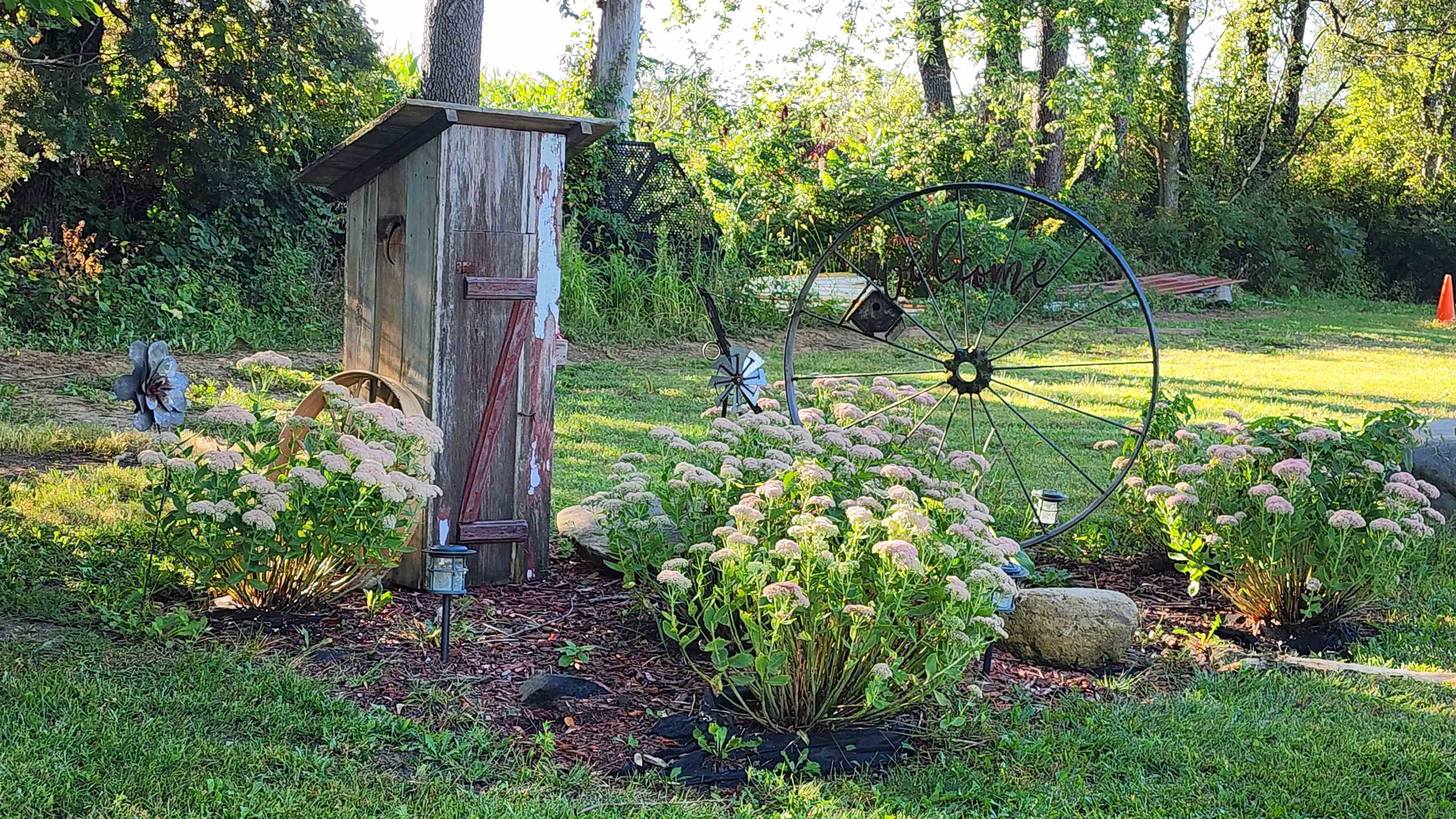 0 North Pecatonica Road Pecatonica, IL 61063 - Photo 20 of 24 a view of a backyard with potted plants and large tree