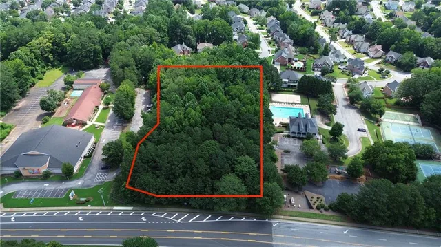 an aerial view of houses with yard