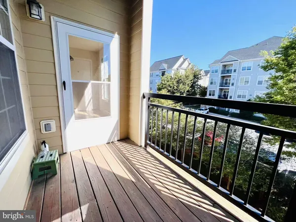 a view of a balcony with wooden floor