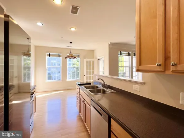 a view of a kitchen with a large window
