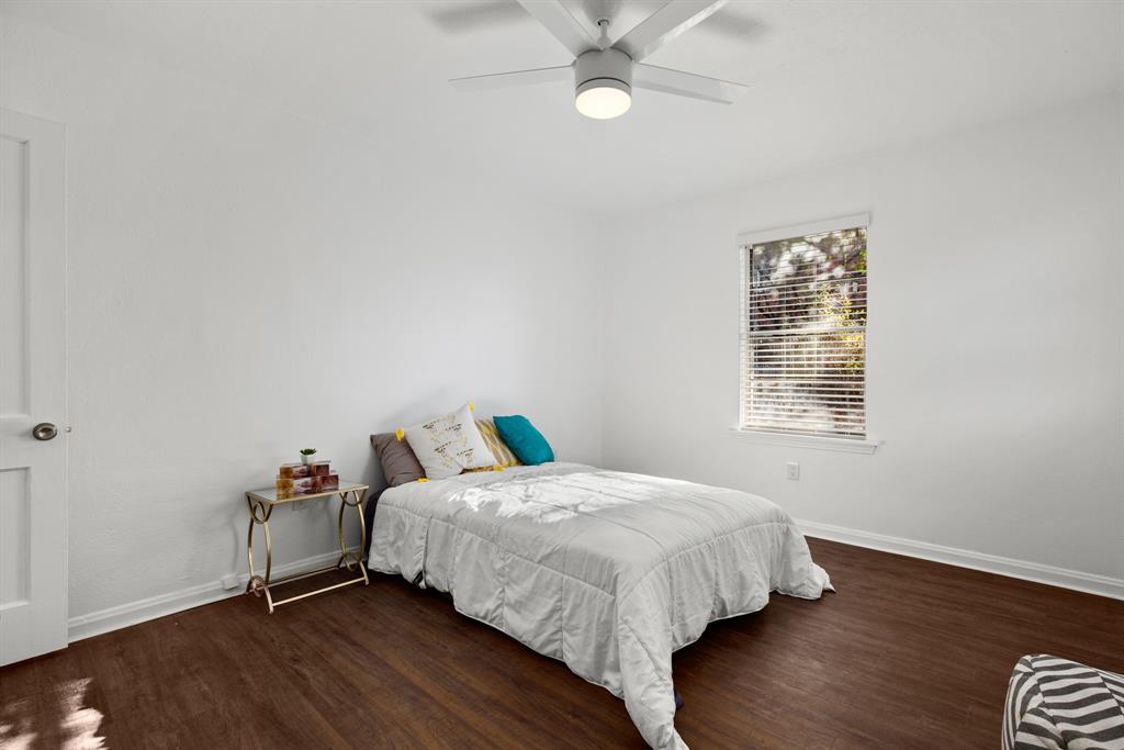 301 East 33rd Street, Unit 4 Austin, TX 78705 - Photo 6 of 10 Bedroom with wood finished floors and a ceiling fan