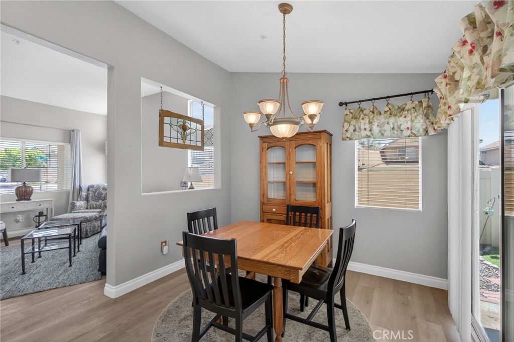 19584 Jill Court Riverside, CA 92508 - Photo 11 of 31 a view of a dining room with furniture window and wooden floor