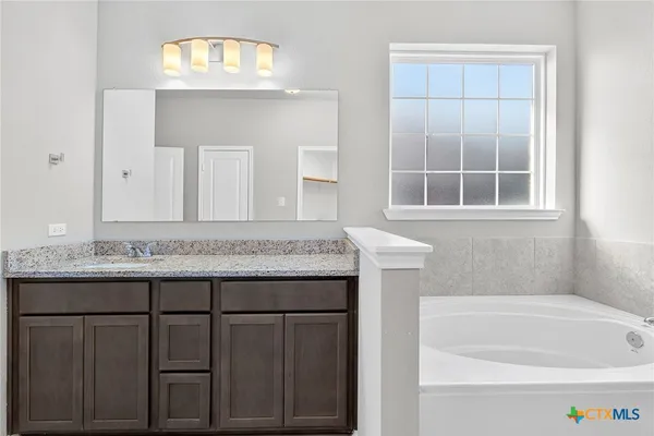 a bathroom with a sink and a bathtub