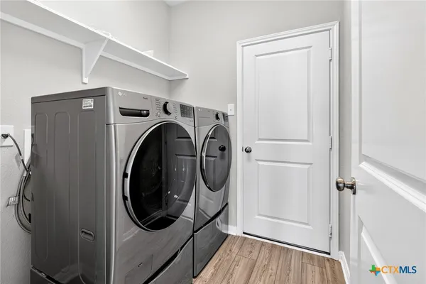 a utility room with dryer and washer