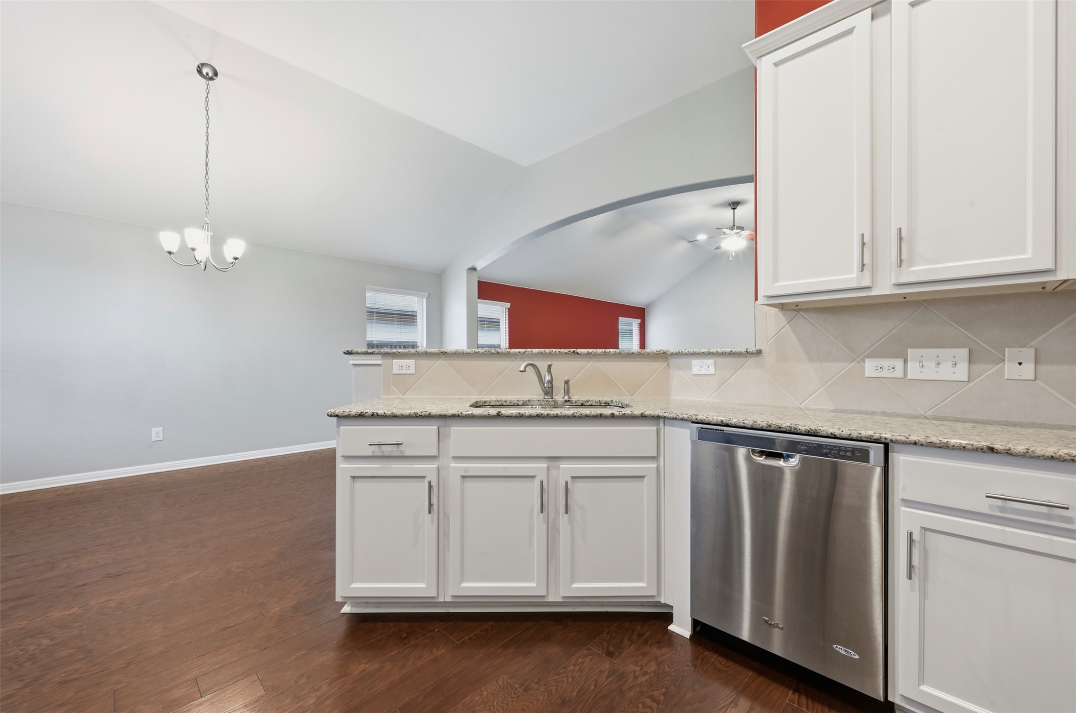 13116 Alans Way Manchaca, TX 78652 - Photo 11 of 25 Kitchen featuring light-colored cabinetry, granite-finish countertops, and a stainless steel dishwasher
