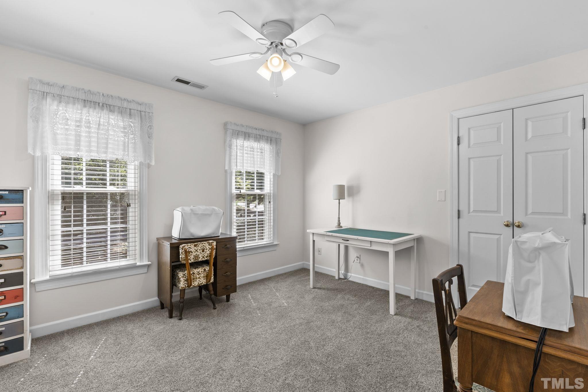 7705 Tylerton Drive Raleigh, NC 27613 - Photo 17 of 35 a view of workspace with furniture window and outside view