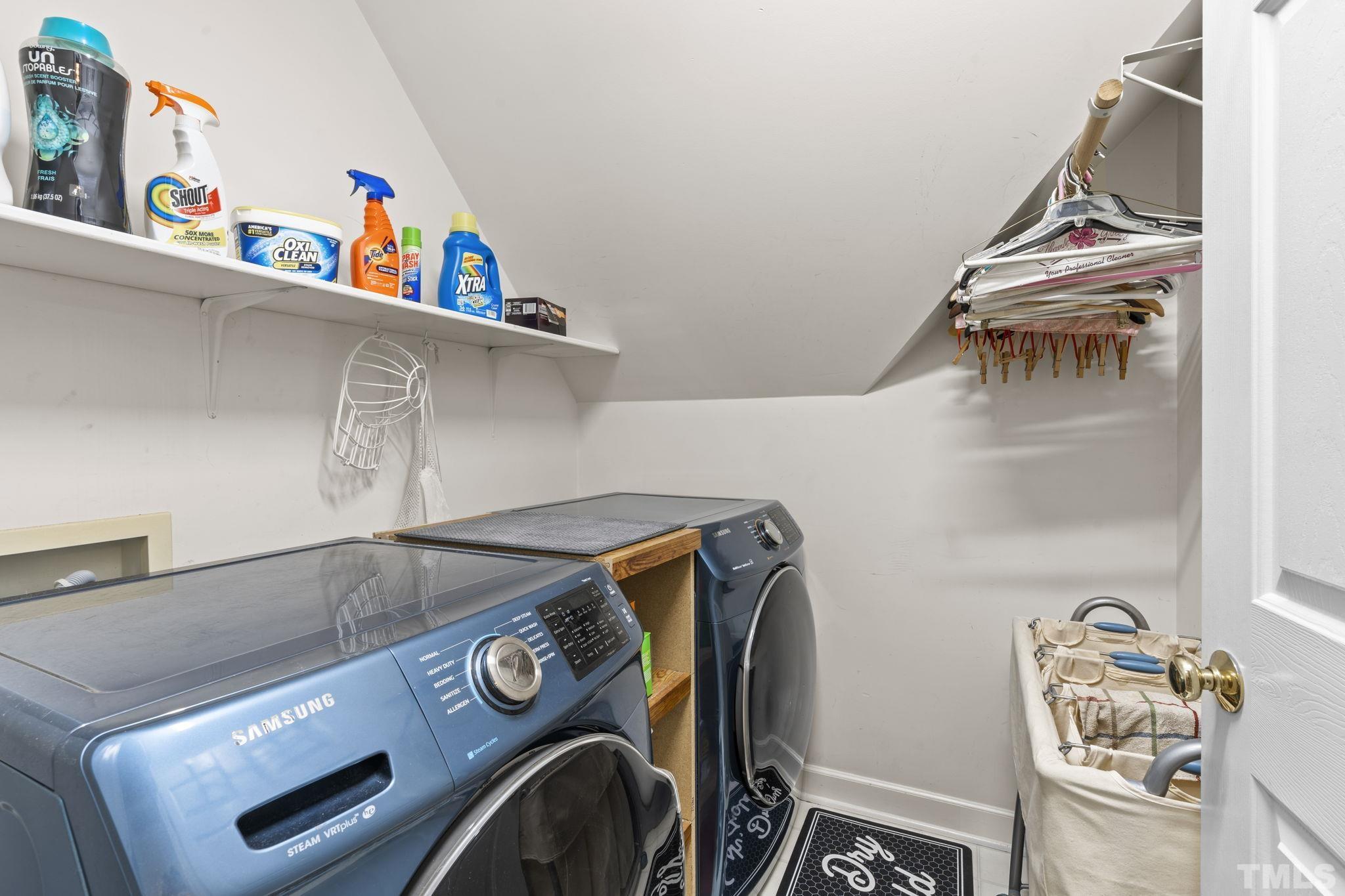 7705 Tylerton Drive Raleigh, NC 27613 - Photo 20 of 35 a utility room with dryer and washer