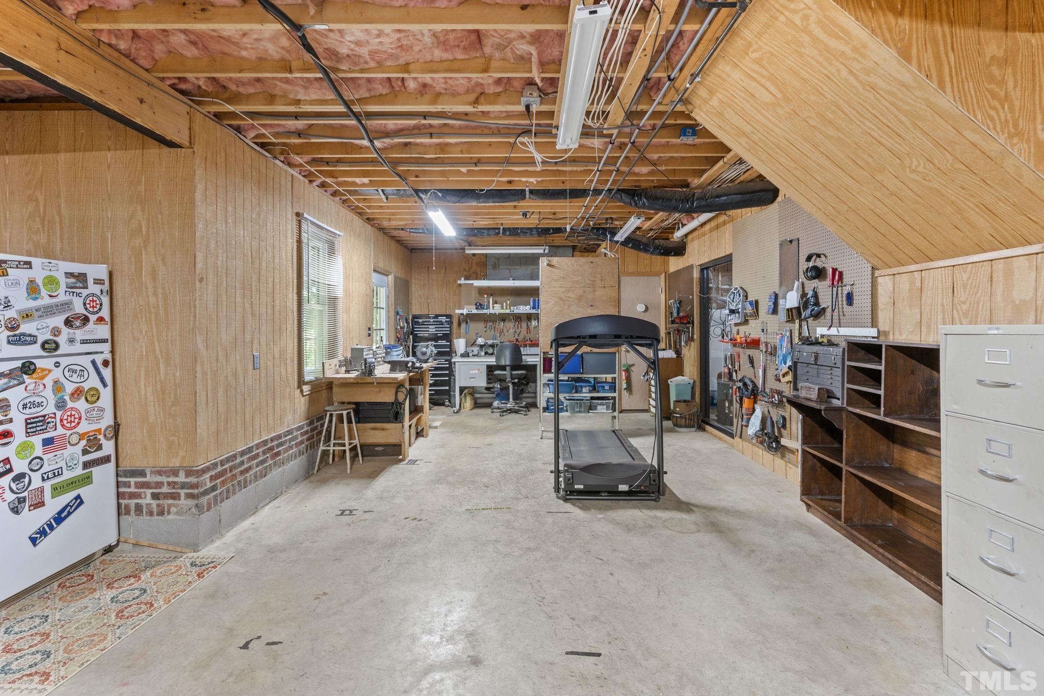 7705 Tylerton Drive Raleigh, NC 27613 - Photo 23 of 35 a view of a storage room with a lot of stuff