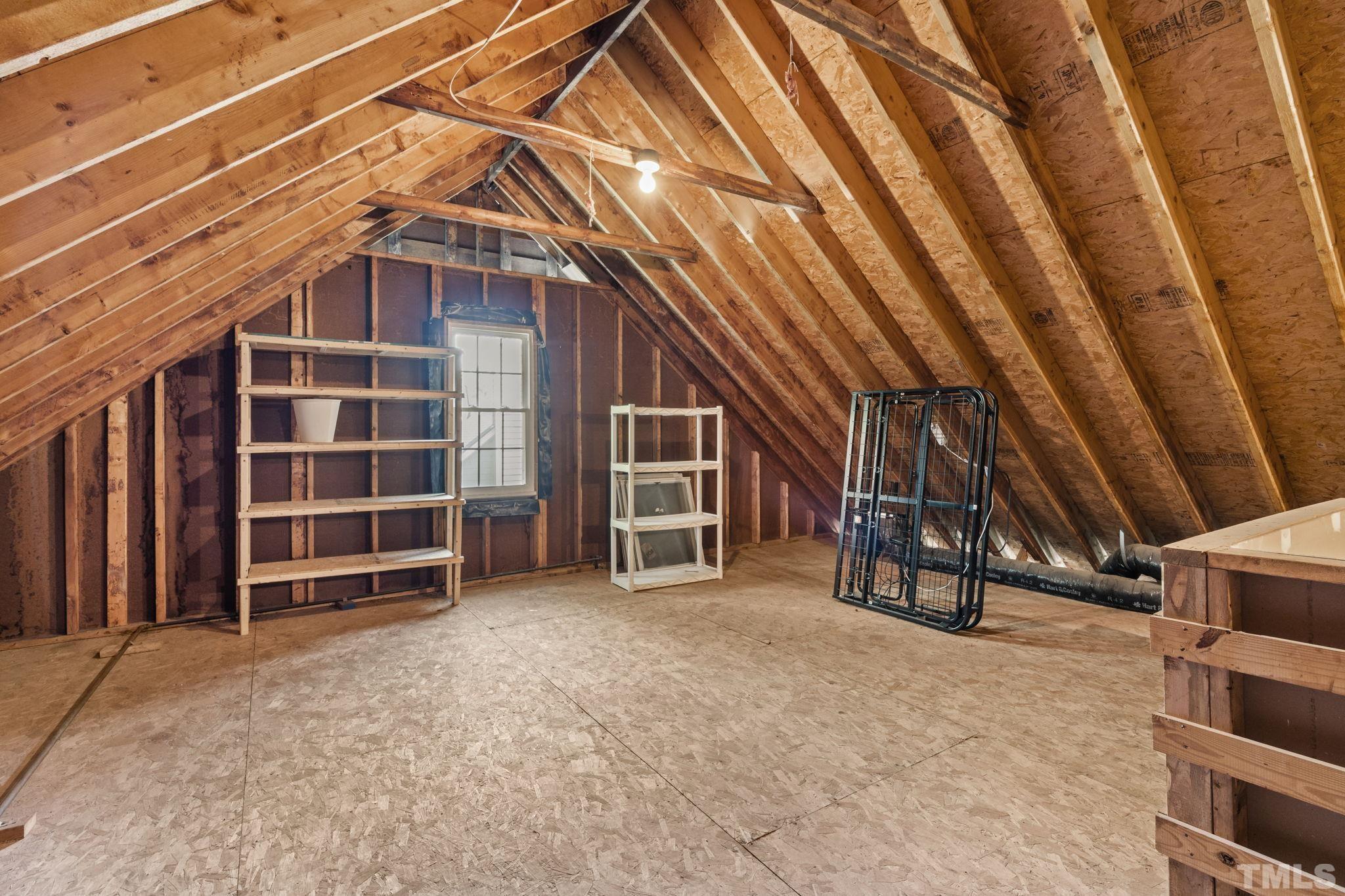 7705 Tylerton Drive Raleigh, NC 27613 - Photo 24 of 35 a view of an empty room with a staircase
