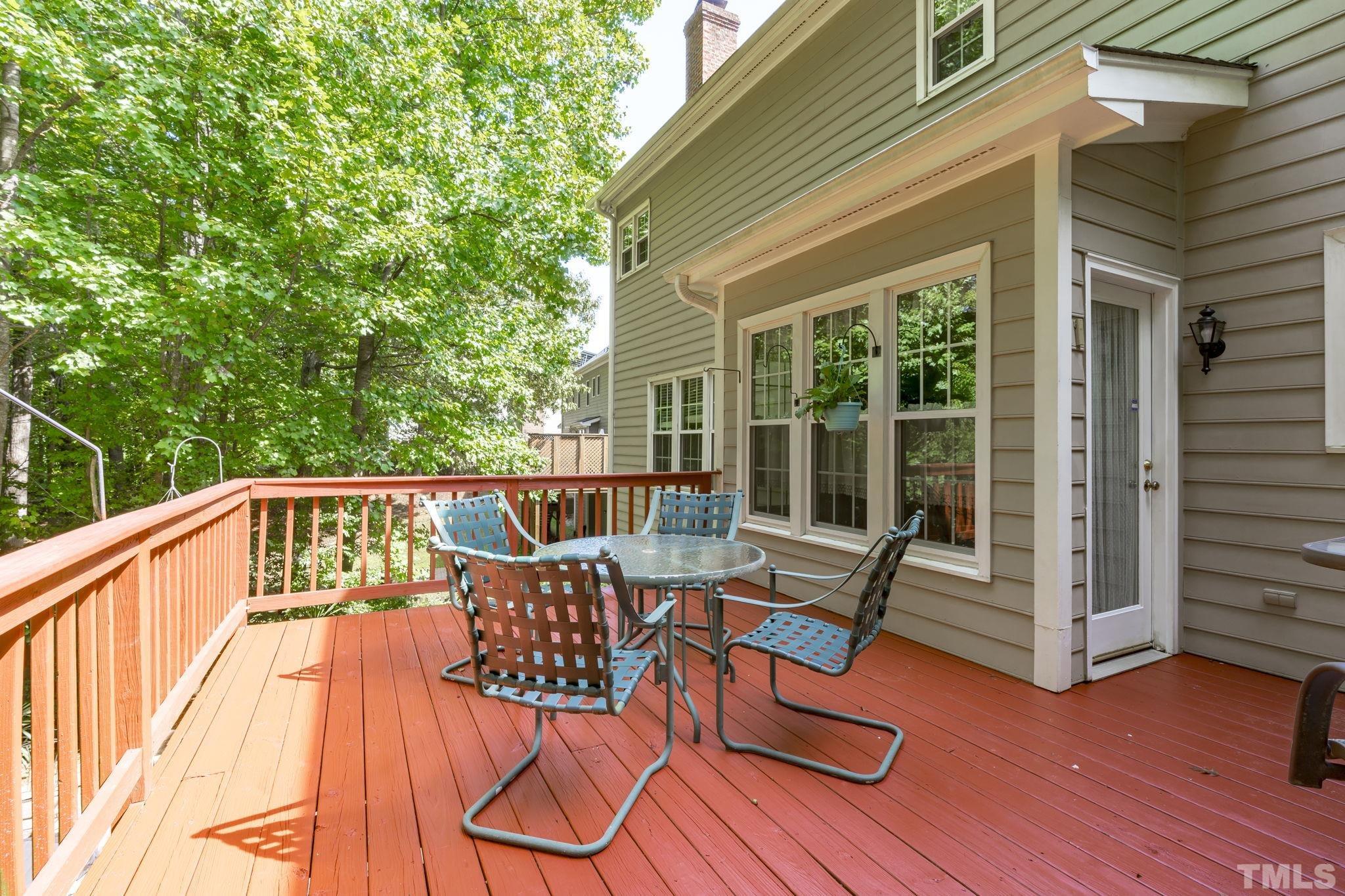7705 Tylerton Drive Raleigh, NC 27613 - Photo 26 of 35 a balcony with chairs and wooden floor