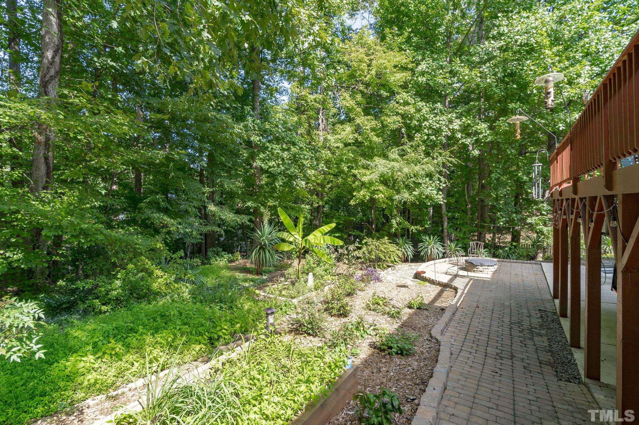7705 Tylerton Drive Raleigh, NC 27613 - Photo 27 of 35 a view of a backyard with pathway