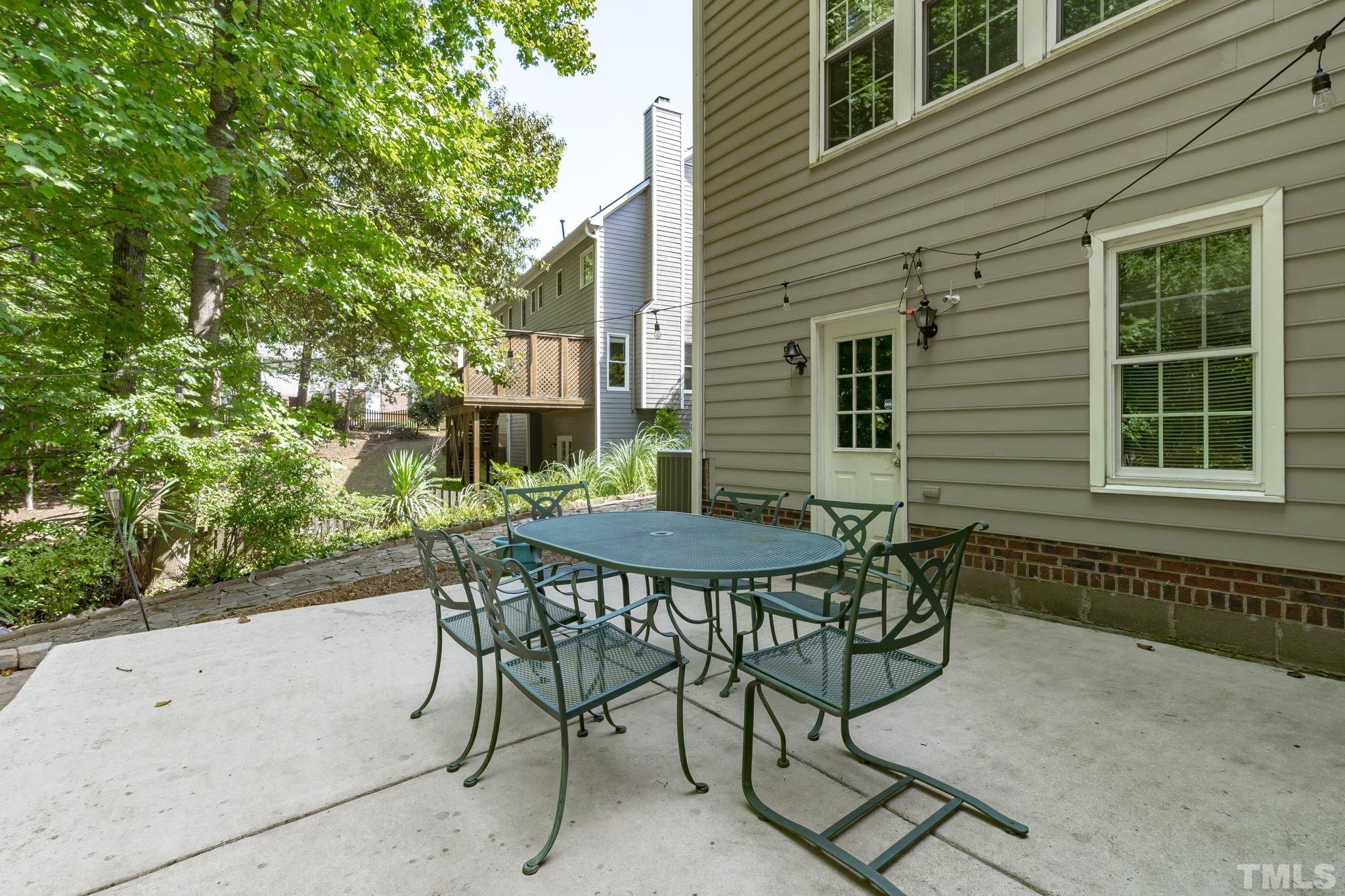 7705 Tylerton Drive Raleigh, NC 27613 - Photo 28 of 35 a view of a chairs and table in the patio