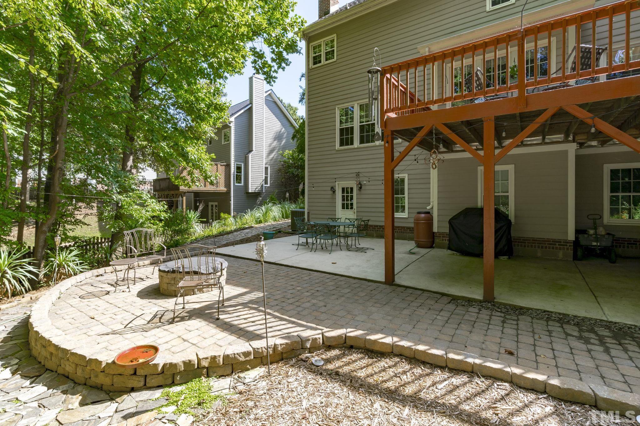 7705 Tylerton Drive Raleigh, NC 27613 - Photo 32 of 35 a view of a house with backyard and sitting area