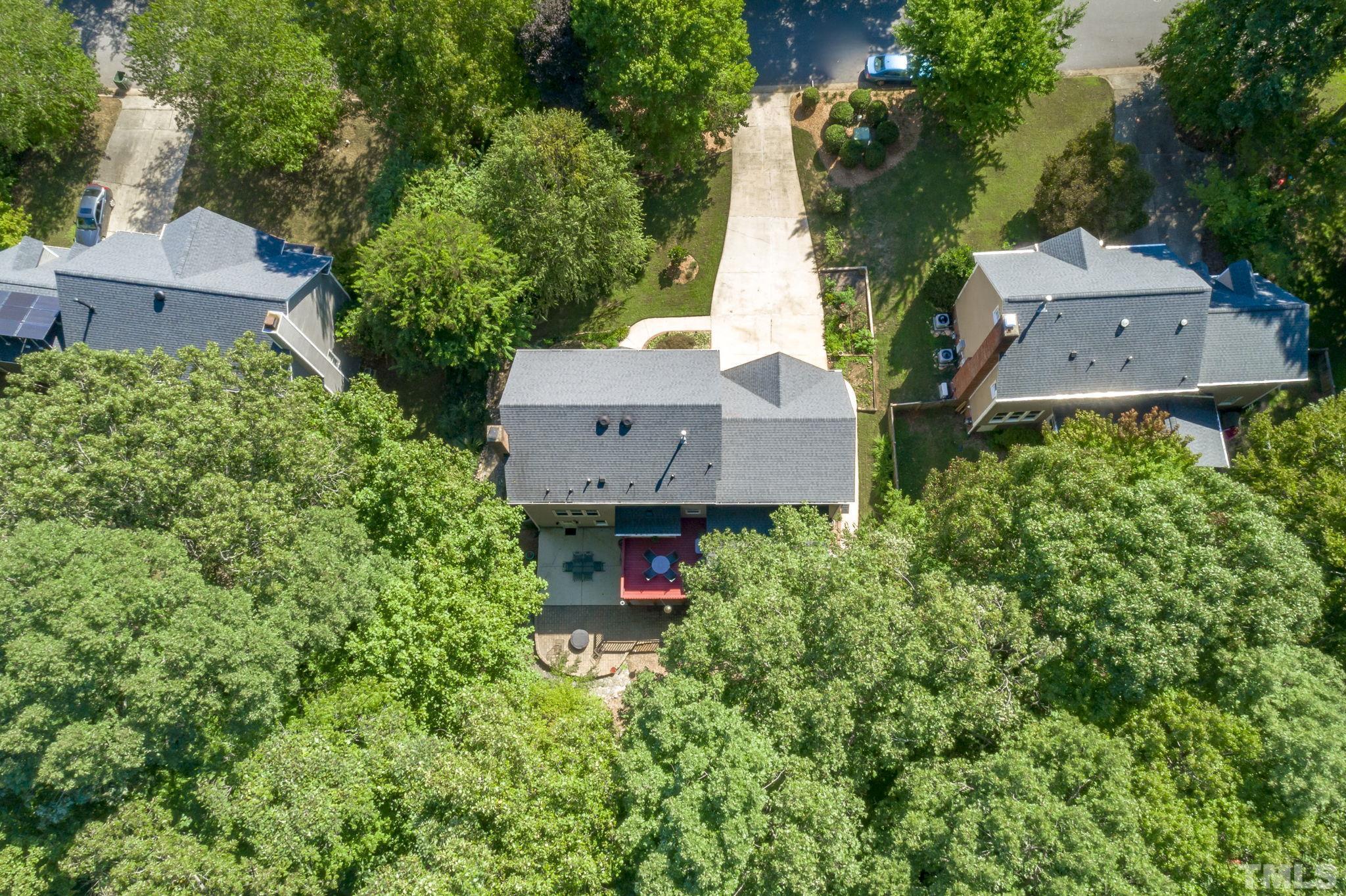7705 Tylerton Drive Raleigh, NC 27613 - Photo 34 of 35 an aerial view of a house with a yard and garden